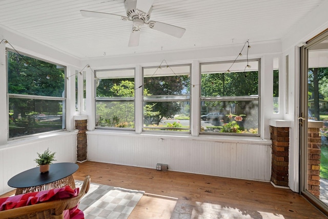4708 Pleasant Ave, Minneapolis, MN 55419 - unfurnished sunroom featuring healthy amount of natural light, wood-type flooring, and a ceiling fan