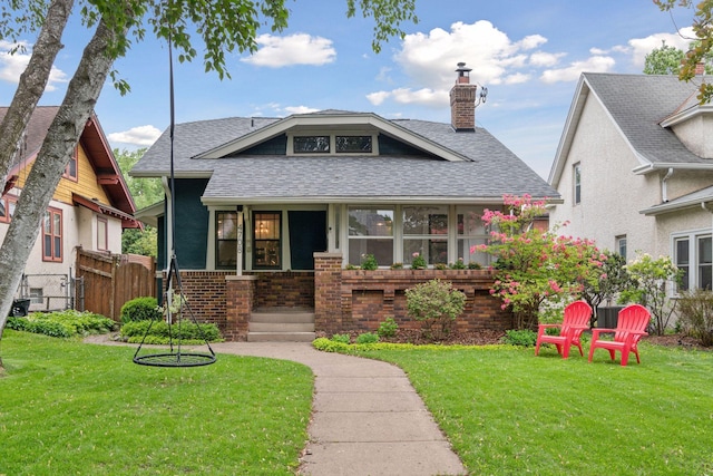 4708 Pleasant Ave, Minneapolis, MN 55419 - bungalow-style house featuring a chimney, roof with shingles, and brick siding