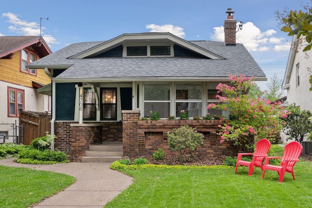 4708 Pleasant Ave, Minneapolis, MN 55419 - bungalow-style house with roof with shingles, a chimney, and brick siding