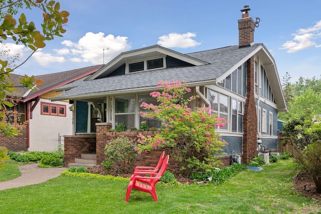 4708 Pleasant Ave, Minneapolis, MN 55419 - view of front of house featuring a shingled roof, a chimney, a front yard, and brick siding