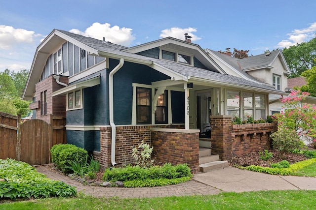 4708 Pleasant Ave, Minneapolis, MN 55419 - view of front facade featuring a shingled roof, brick siding, and a chimney