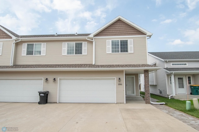 1381 Westport Beach Way W, Fargo, ND 58078 - townhome / multi-family property with driveway, an attached garage, and entry steps