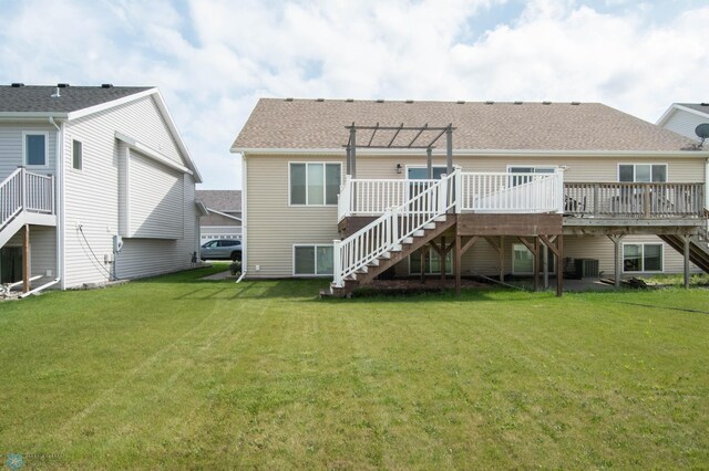 1381 Westport Beach Way W, Fargo, ND 58078 - rear view of house with stairs, a deck, a yard, and a pergola