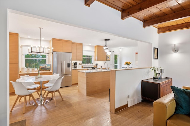 18201 Kathleene Dr, Minnetonka, MN 55345 - kitchen with appliances with stainless steel finishes, a wooden ceiling with exposed beams, light countertops, modern cabinets, and light wood finished floors