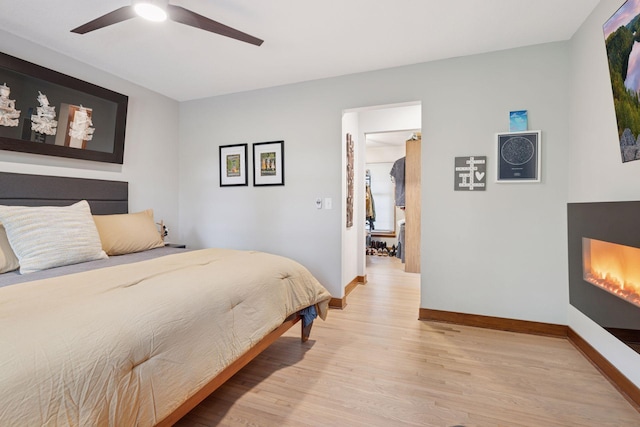 18201 Kathleene Dr, Minnetonka, MN 55345 - bedroom featuring light wood finished floors and ceiling fan