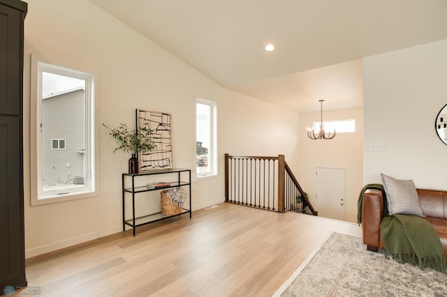 6153 Martin Ln W, West Fargo, ND 58078 - living area featuring an upstairs landing, light wood-style flooring, a chandelier, and recessed lighting