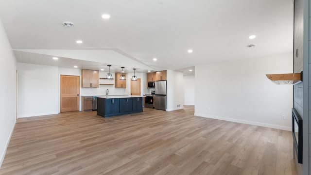 322 Old Glory Dr NE, Alexandria, MN 56308 - kitchen featuring open floor plan, appliances with stainless steel finishes, light wood-style flooring, lofted ceiling, and light countertops