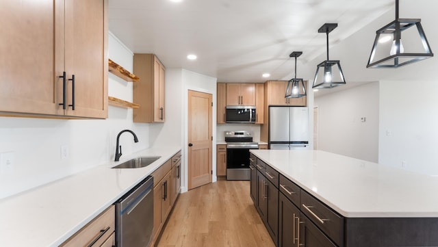 322 Old Glory Dr NE, Alexandria, MN 56308 - kitchen featuring stainless steel appliances, recessed lighting, light wood-style floors, light countertops, and a kitchen island
