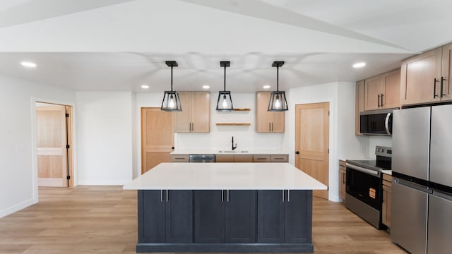 322 Old Glory Dr NE, Alexandria, MN 56308 - kitchen with stainless steel appliances, recessed lighting, light wood-style floors, light countertops, and a kitchen island
