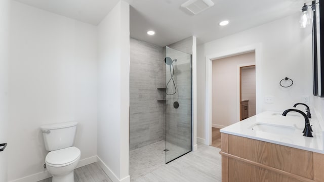 322 Old Glory Dr NE, Alexandria, MN 56308 - bathroom featuring double vanity, a walk in shower, and recessed lighting