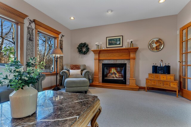 617 17th St N, Sartell, MN 56377 - living room featuring a tiled fireplace, recessed lighting, and carpet floors