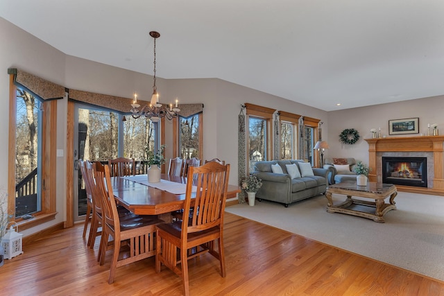 617 17th St N, Sartell, MN 56377 - dining area featuring a chandelier, light wood finished floors, a glass covered fireplace, and recessed lighting