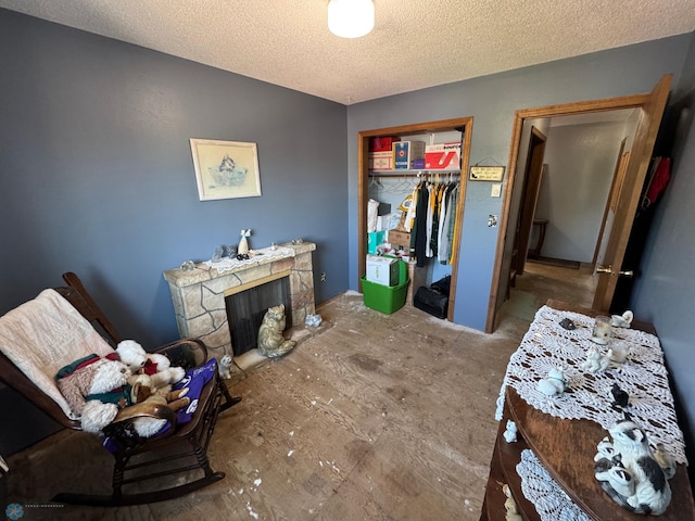238 18th St E, West Fargo, ND 58078 - bedroom with a fireplace, a textured ceiling, and a closet