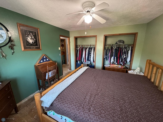 238 18th St E, West Fargo, ND 58078 - bedroom featuring two closets, a textured ceiling, and a ceiling fan