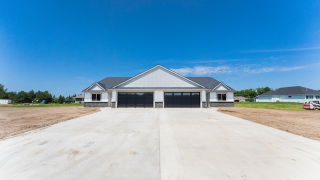 324 Old Glory Dr NE, Alexandria, MN 56308 - modern farmhouse style home with an attached garage, stone siding, and concrete driveway