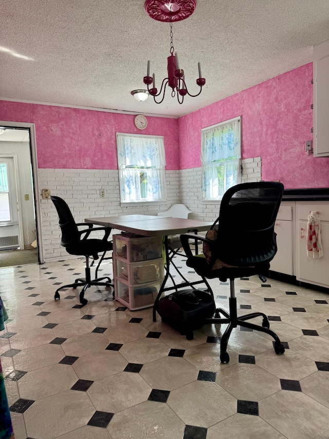 413 3rd Ave SE, Baudette, MN 56623 - home office with plenty of natural light, a chandelier, a textured ceiling, light flooring, and wainscoting