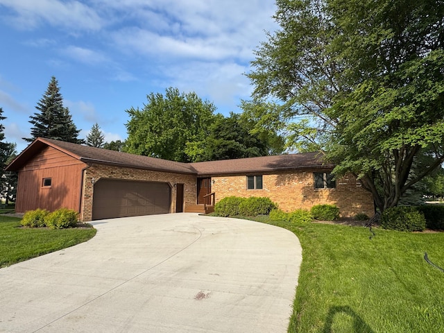 605 Arbor Ct, Marshall, MN 56258 - ranch-style house featuring driveway, brick siding, a front lawn, and a garage