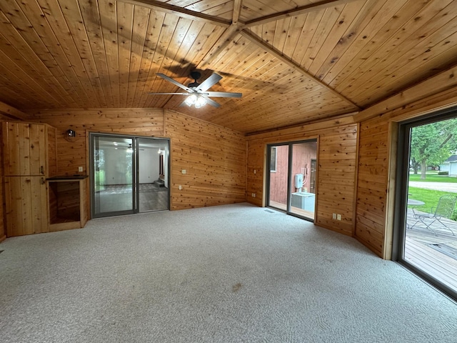 605 Arbor Ct, Marshall, MN 56258 - carpeted spare room featuring wooden ceiling, vaulted ceiling, wood walls, and a ceiling fan