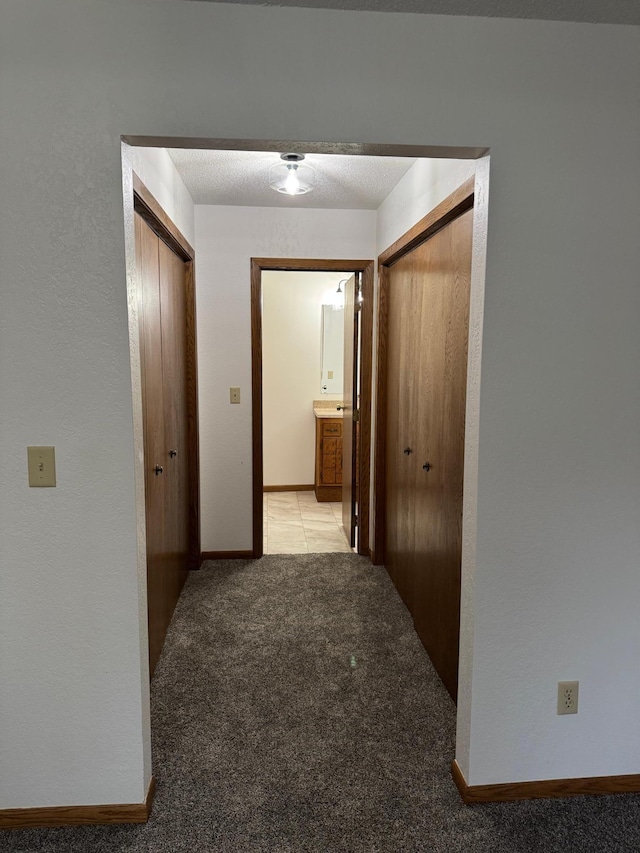 605 Arbor Ct, Marshall, MN 56258 - hall with light carpet and baseboards