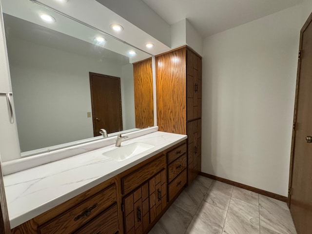 605 Arbor Ct, Marshall, MN 56258 - bathroom with vanity, recessed lighting, and marble finish floors