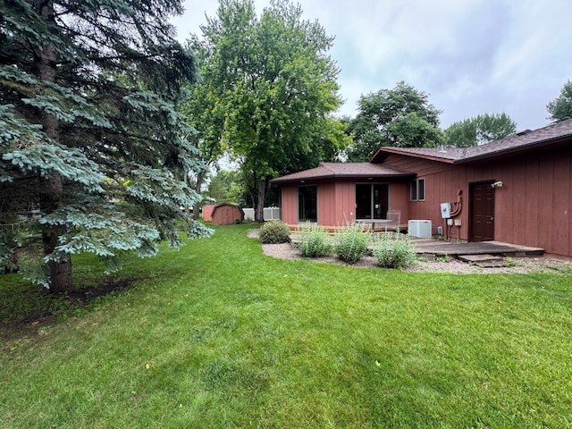 605 Arbor Ct, Marshall, MN 56258 - view of grassy yard featuring a shed