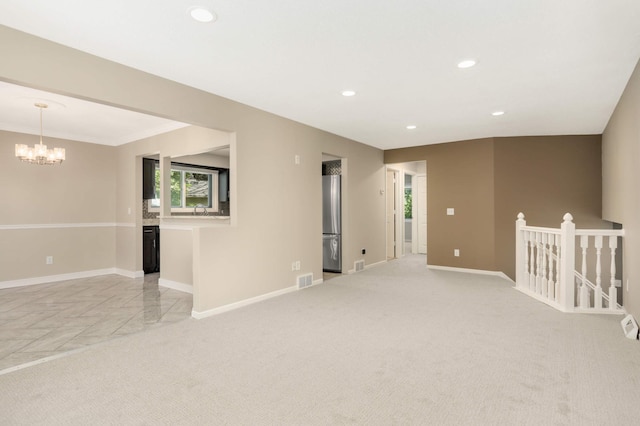 2217 73rd Ct N, Brooklyn Park, MN 55444 - spare room featuring a chandelier, recessed lighting, and light carpet