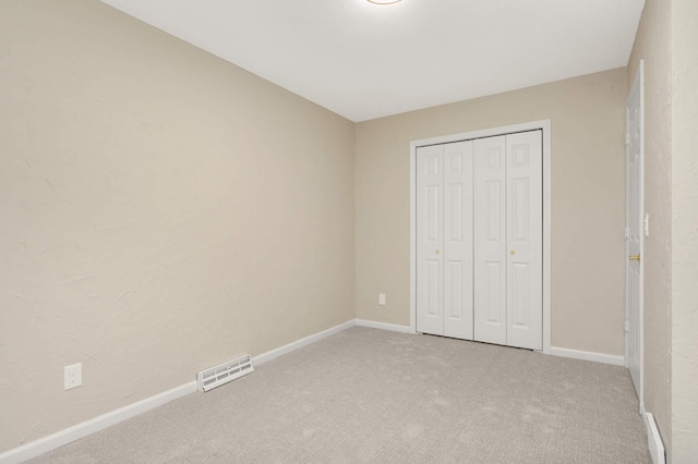 2217 73rd Ct N, Brooklyn Park, MN 55444 - unfurnished bedroom with light colored carpet and a closet