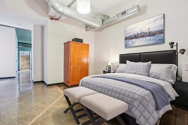 350 Saint Peter St Unit 1110, Saint Paul, MN 55102 - bedroom with baseboards and speckle patterned floor