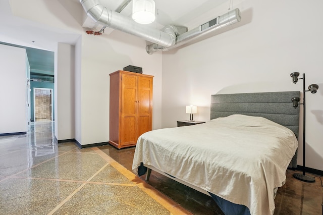 350 Saint Peter St Unit 1110, Saint Paul, MN 55102 - bedroom featuring baseboards and a towering ceiling
