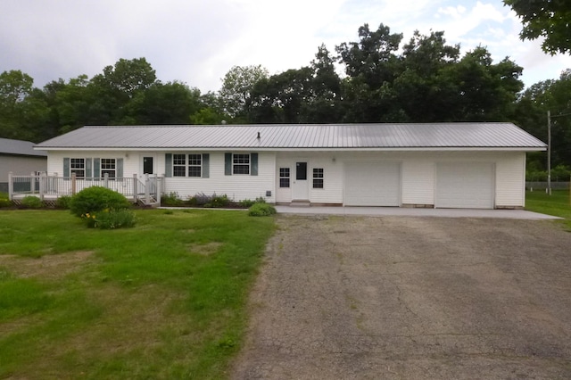 N6217 Kirk Rd, Durand, WI 54736 - single story home with a front yard, a metal roof, an attached garage, and driveway