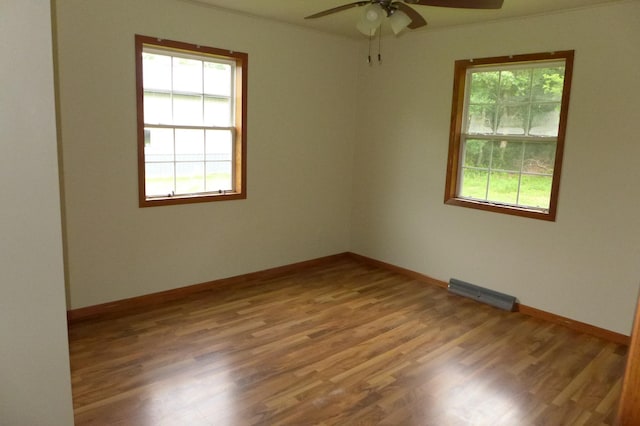 N6217 Kirk Rd, Durand, WI 54736 - unfurnished room with plenty of natural light, a ceiling fan, and wood finished floors
