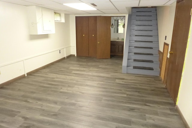 N6217 Kirk Rd, Durand, WI 54736 - basement featuring a paneled ceiling and wood finished floors