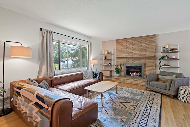 941 Cannon Ave, Shoreview, MN 55126 - living room featuring wood finished floors and a fireplace