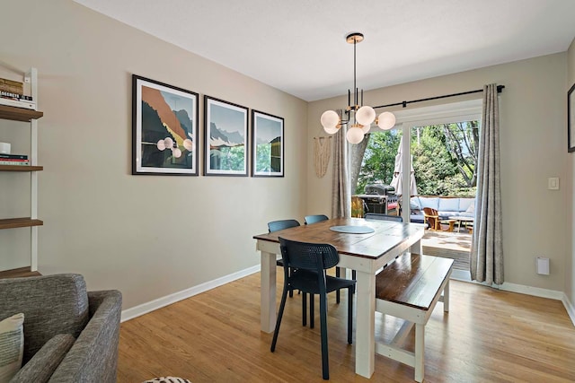 941 Cannon Ave, Shoreview, MN 55126 - dining space featuring light wood-style flooring and a chandelier