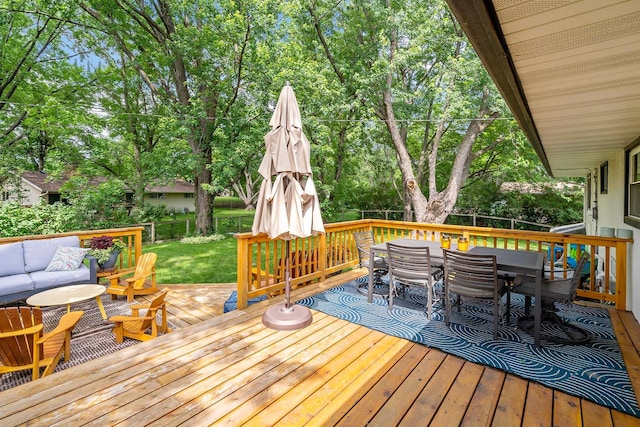 941 Cannon Ave, Shoreview, MN 55126 - wooden deck with outdoor dining area, an outdoor hangout area, and view of wooded area