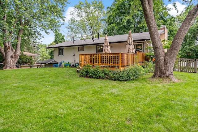941 Cannon Ave, Shoreview, MN 55126 - rear view of property with a chimney, a wooden deck, and stucco siding