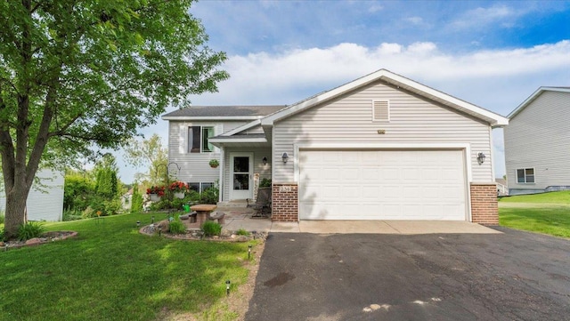 234 17th Ave SE, Saint Joseph, MN 56374 - tri-level home featuring brick siding, driveway, and a front lawn