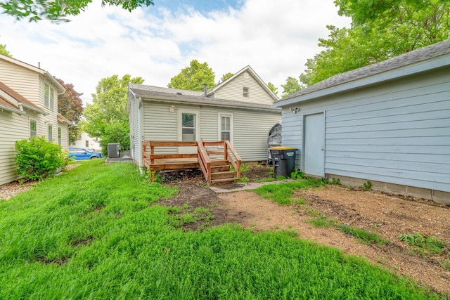 421 Moore St, Blue Earth, MN 56013 - rear view of property featuring a wooden deck and a yard