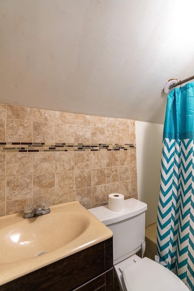 421 Moore St, Blue Earth, MN 56013 - full bathroom with tile walls, vanity, and shower / bath combo