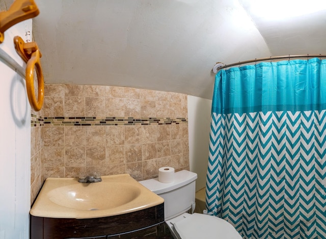 421 Moore St, Blue Earth, MN 56013 - bathroom featuring tile walls, vanity, and curtained shower