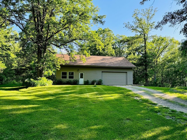 2795 40th St NW, Hackensack, MN 56452 - view of side of home with driveway, a yard, a garage, and a shingled roof