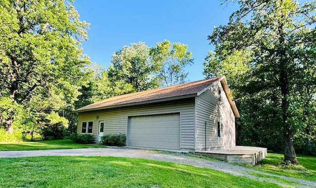 2795 40th St NW, Hackensack, MN 56452 - view of home's exterior featuring a lawn, an outdoor structure, and driveway