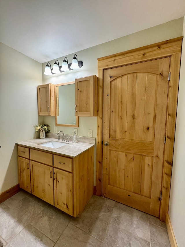 2795 40th St NW, Hackensack, MN 56452 - bathroom with vanity and stone finish floors