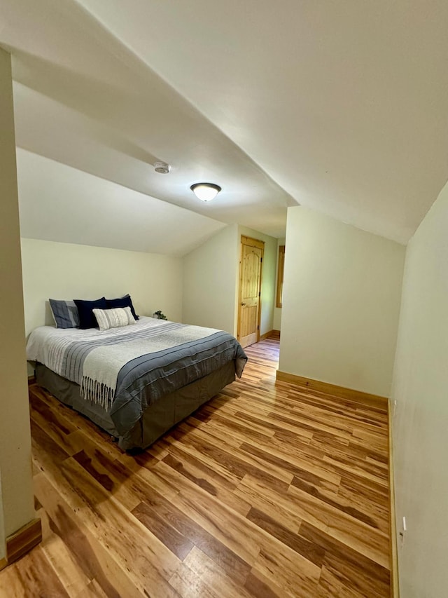 2795 40th St NW, Hackensack, MN 56452 - bedroom featuring light wood finished floors and vaulted ceiling