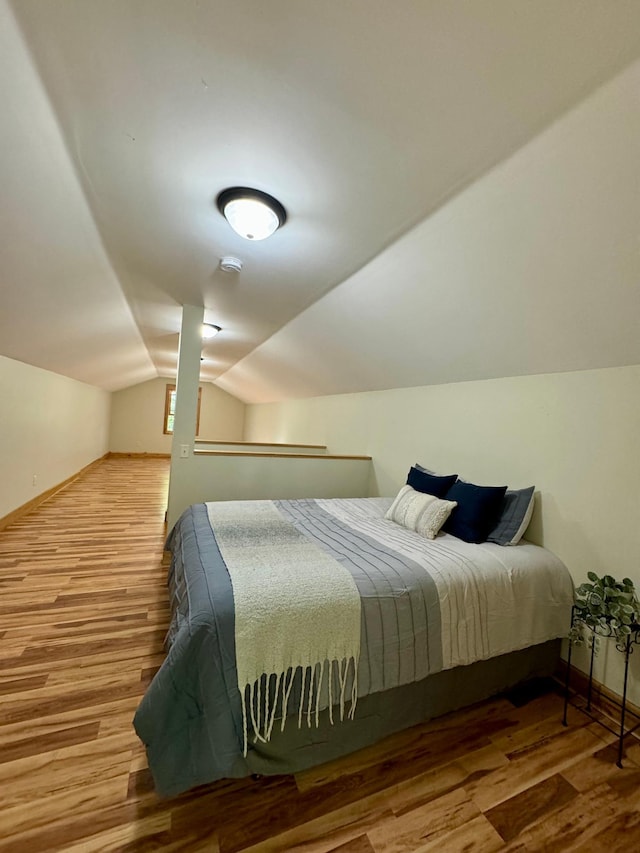 2795 40th St NW, Hackensack, MN 56452 - bedroom featuring wood finished floors and vaulted ceiling