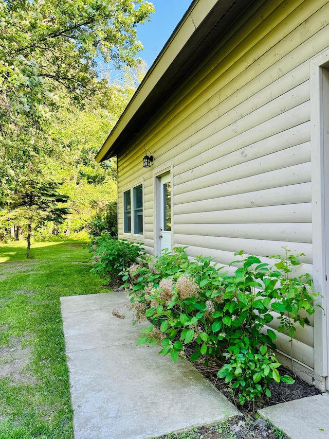2795 40th St NW, Hackensack, MN 56452 - view of home's exterior featuring a patio area and a yard