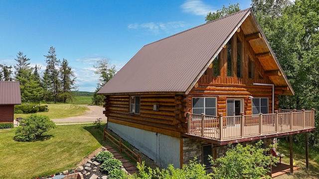 2338 Olson Rd, Blackhoof Twp, MN 55718 - view of side of home featuring log siding, a yard, a metal roof, and a deck