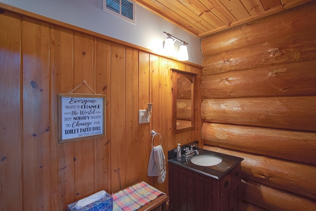 2338 Olson Rd, Blackhoof Twp, MN 55718 - bathroom with rustic walls, wood ceiling, and vanity