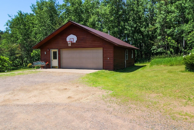2338 Olson Rd, Blackhoof Twp, MN 55718 - view of front of house featuring an outdoor structure, a detached garage, and a front yard