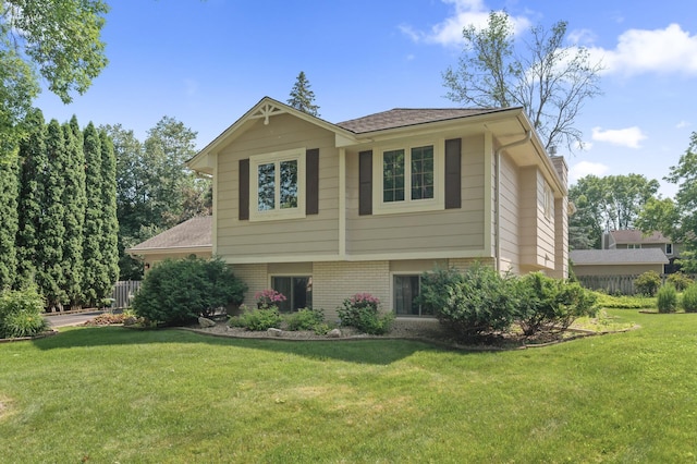 6469 Deerwood Ln N, Maple Grove, MN 55369 - view of front facade featuring brick siding and a front lawn
